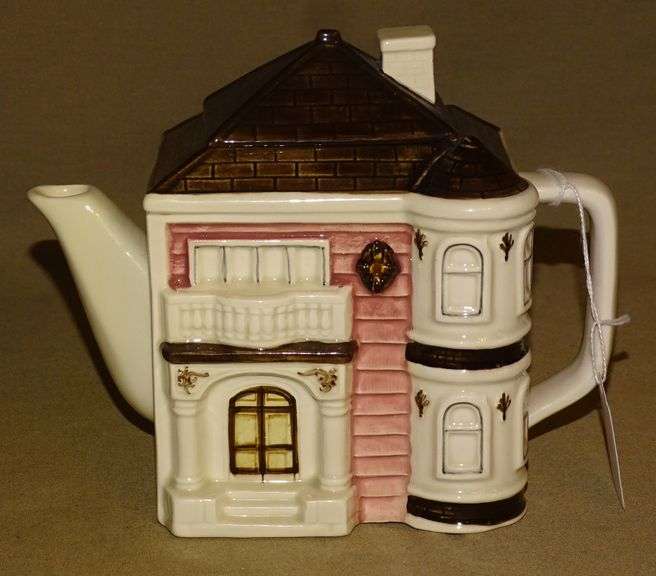 2 Cottage Style Teapots. Rocky Mountain Estate Brokers Inc.