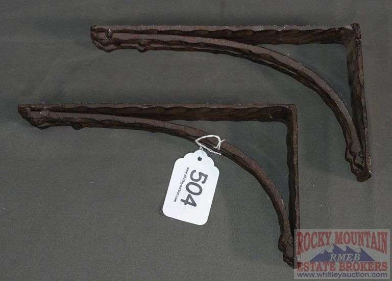 2 Cast Iron Shelf Brackets. Rocky Mountain Estate Brokers Inc.