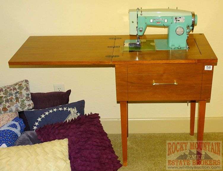 White Sewing Machine In Rocky Mountain Estate Brokers Inc.