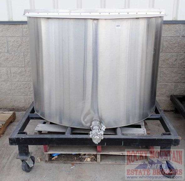 Large stainless steel singlewall tank on rolling steel stand. Rocky