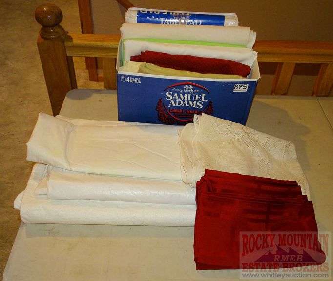Assorted table cloths and table pads. All for one money. Rocky