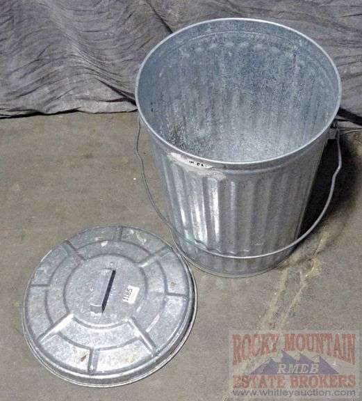 Small galvanized trash can with lid, 24" high. Rocky Mountain Estate Brokers Inc.