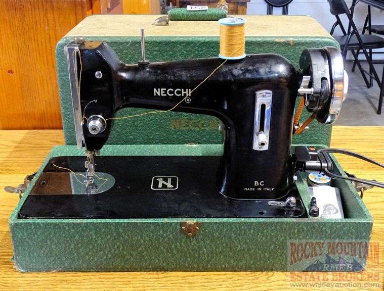 Vintage Necchi made in Italy sewing machine with case and foot pedal. Rocky Mountain Estate