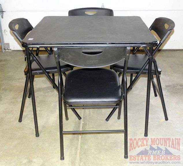Nice Cosco black folding card table with 4 folding chairs. Rocky