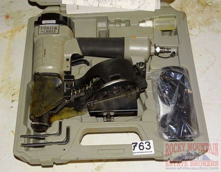 Porter Cable coil roofing nailer in case. Rocky Mountain Estate Brokers Inc.