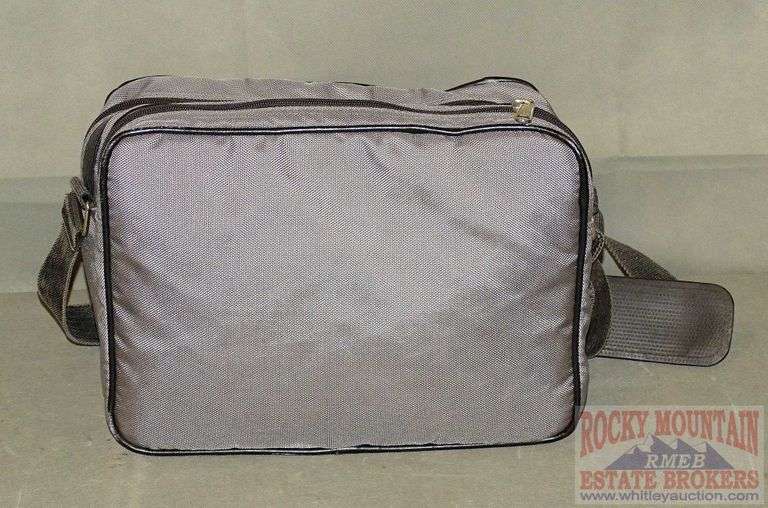 Nice camera bag w/ shoulder strap. Rocky Mountain Estate Brokers Inc.