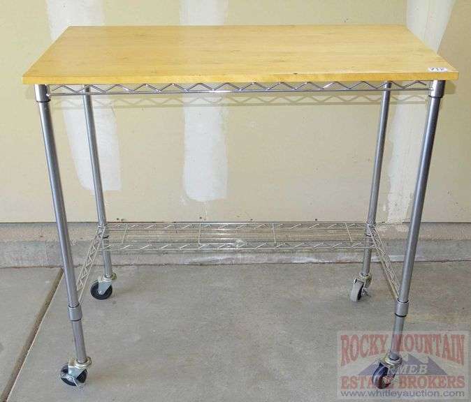 Nice rolling metro style shelf with butcher block top, 36"X37"X19