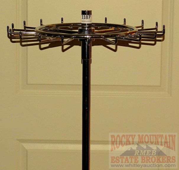 Commercial grade chrome revolving belt rack, 53" high. Rocky Mountain