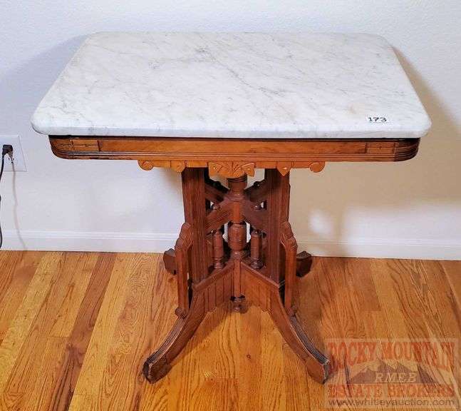 Great Victorian Eastlake style marble top table. This antique table is in nice condition