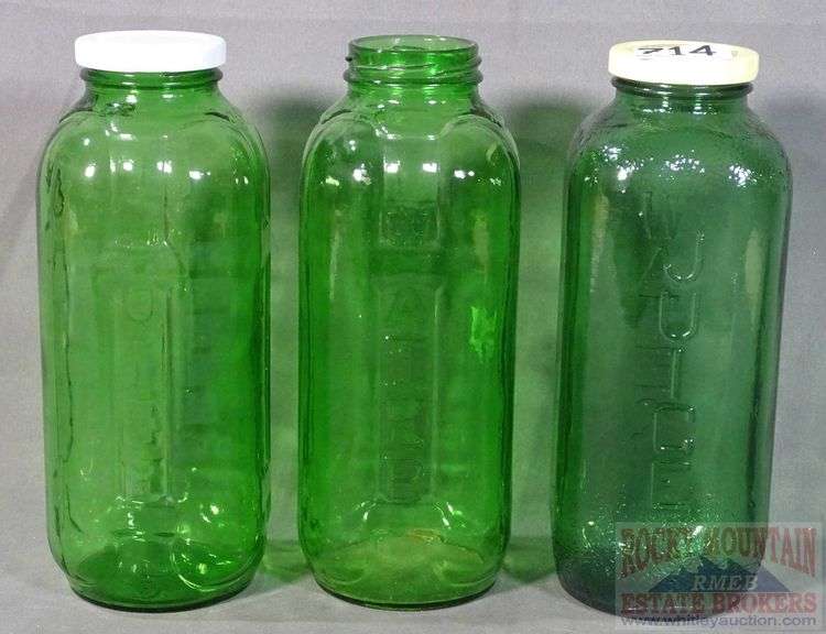 3 Vintage Green Glass Water/Juice Bottles. All for one money. Rocky Mountain Estate Brokers Inc.