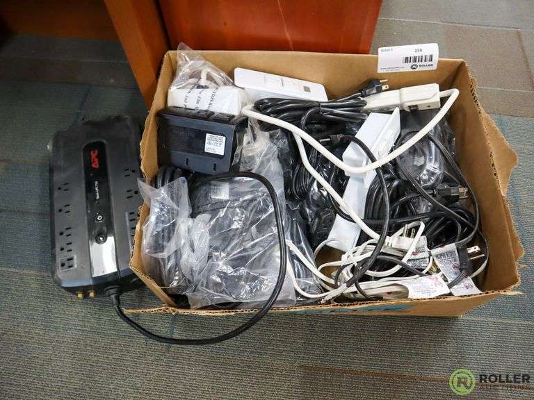 Tray of Battery Backups and Extension Cords Roller Auctions