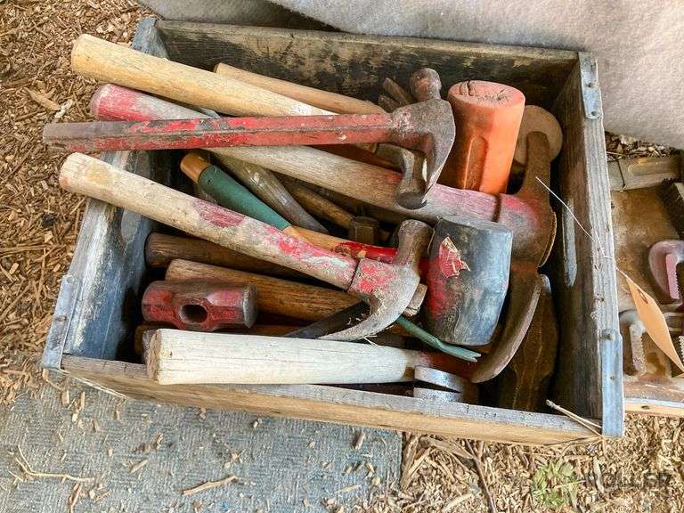 Box of Hammers and Pipe Wrenches and Grasping Hooks on Bench Roller