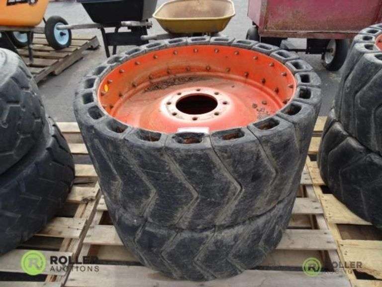 (2) 8Lug Skid Steer Wheels With Segmented Flatproof Tires Roller
