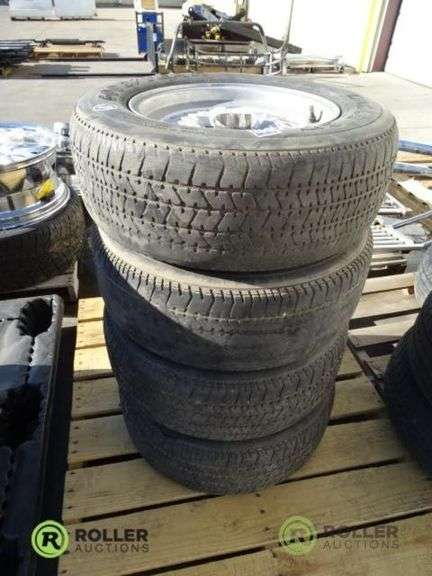 (4) Goodyear Eagle GT P215/65R15 Tires With 5-Lug Rims - Roller Auctions
