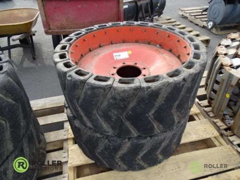 (2) 8Lug Skid Steer Wheels With Segmented Flatproof Tires Roller