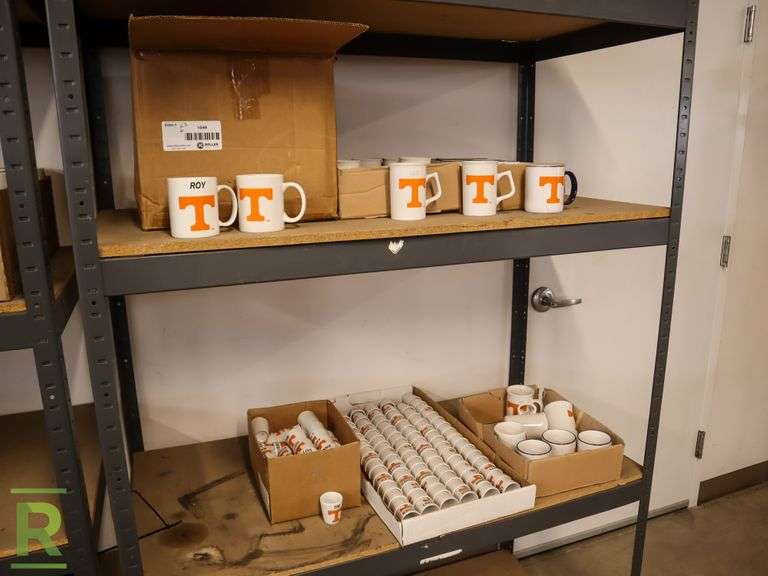 (2) Shelves of Tennessee Volunteers Name Branded Coffee Cups and Shot Glasses - Roller Auctions