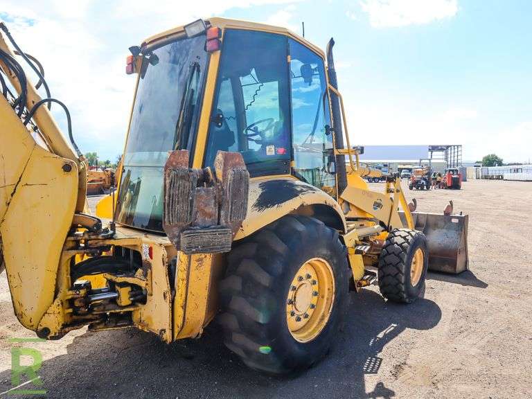 Komatsu WB1502 4WD Loader/Backhoe Roller Auctions