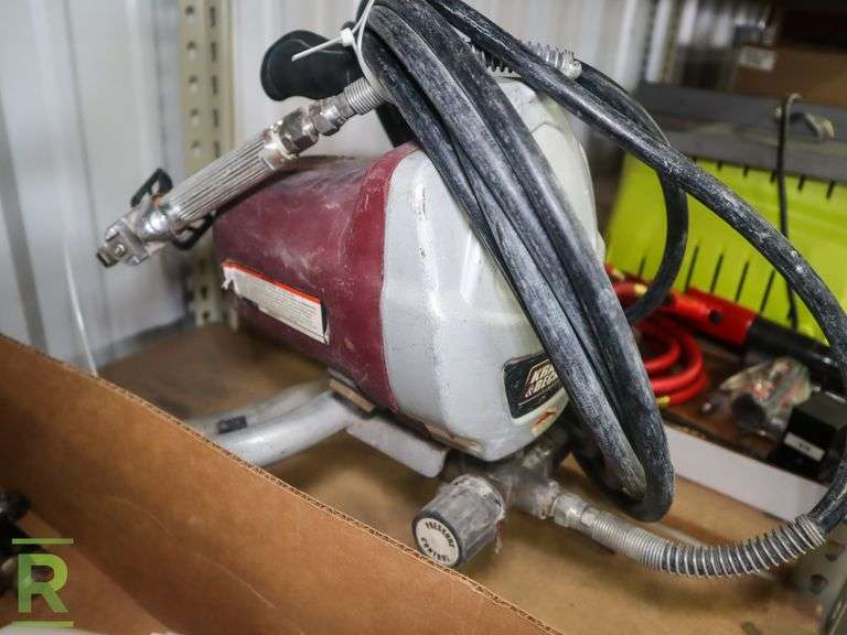 Krause and Becker Airless Paint Sprayer With Tray of Paint Guns