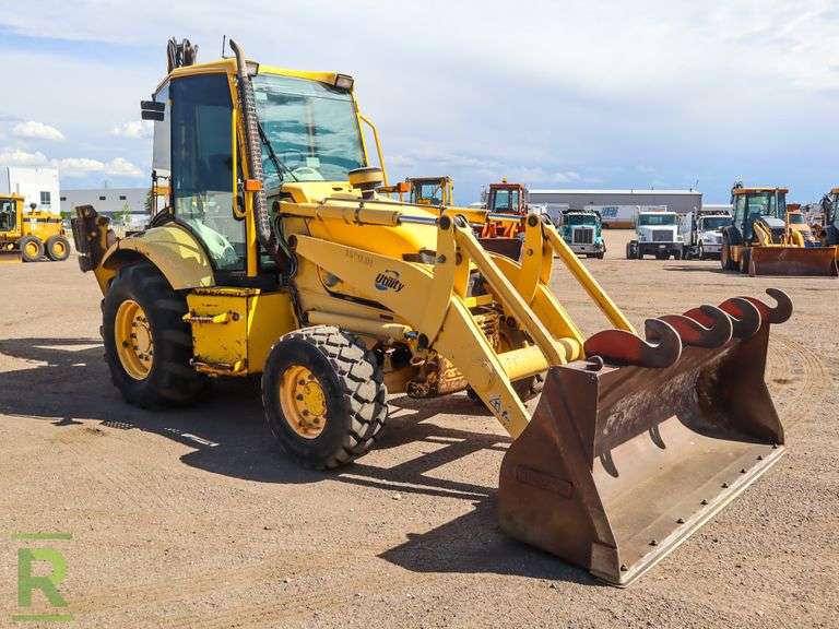 Komatsu WB1502 4WD Loader/Backhoe Roller Auctions