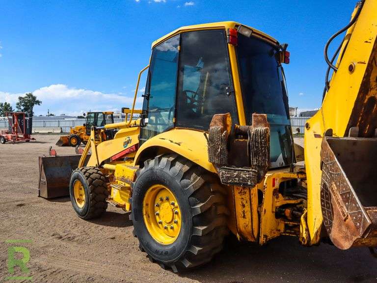 Komatsu WB1502 4WD Loader/Backhoe Roller Auctions