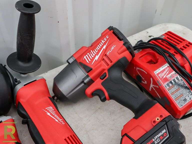 (2) Milwaukee 268020 Grinders, 276720 1/2" Impact, (2) Batteries and