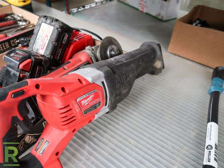 Tray of Milwaukee M18 Power Tools With Batteries and Charger Roller