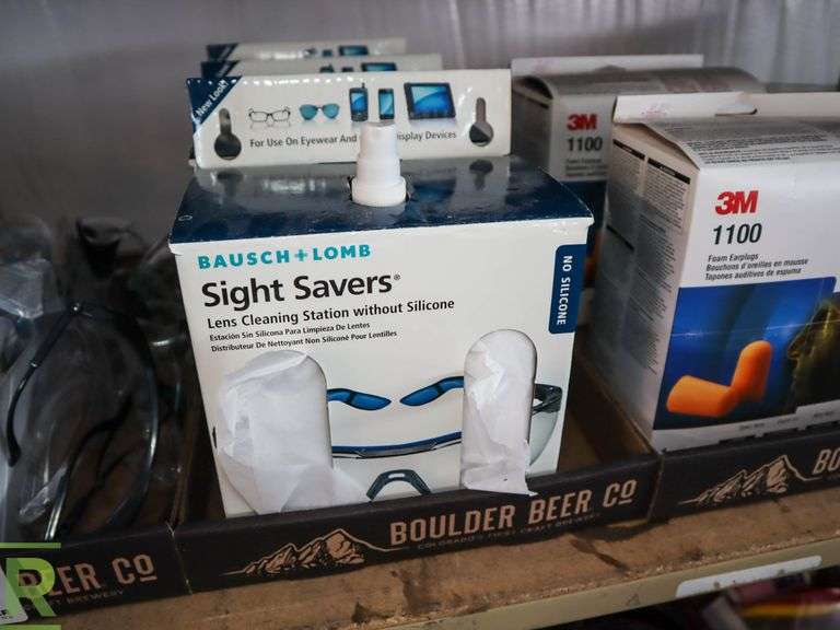 Shelf of Safety Glasses, Lens Cleaning Stations, Earplugs and Glasses