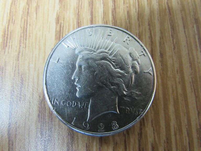 1928 U.S. DOLLAR COIN WITH "IN GOD WE TRVST" (sold 20x the money