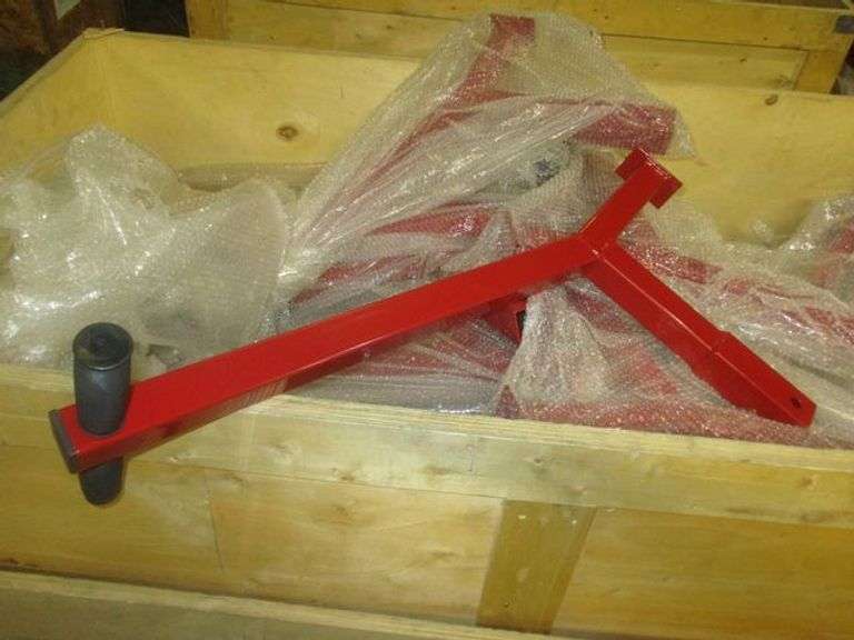 LOT OF ASSORTED PARTS AND COMPONENTS IN HEAVY CRATE, MOSTLY HANDLES AS