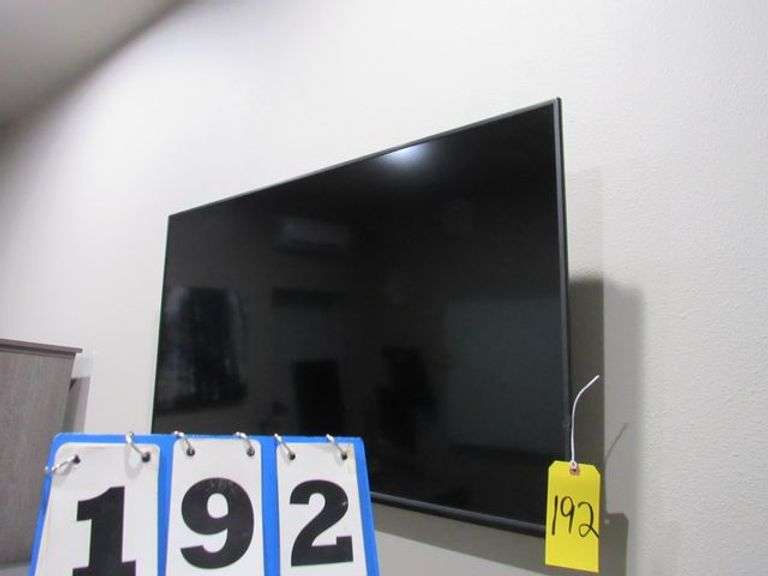 48" VIZIO TV, WALL MOUNTED WITH REMOTE *BIDDER MUST REMOVE PROPERLY