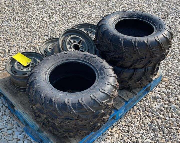 4 unused ATV wheels and tires Schneider Auctioneers LLC