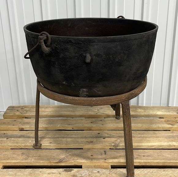 Antique iron kettle w/ stand Schneider Auctioneers LLC