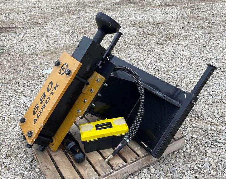 Unused Agrotk 680 skid steer post driver Schneider Auctioneers LLC