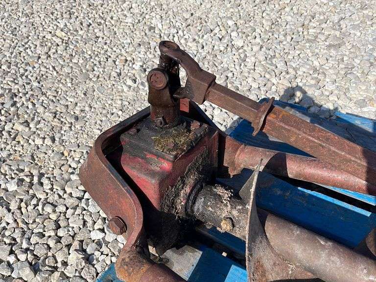 2pt post hole digger for Ford tractor Schneider Auctioneers LLC