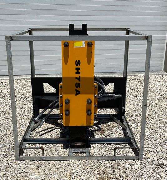 Unused Uppro skid steer post driver Schneider Auctioneers LLC