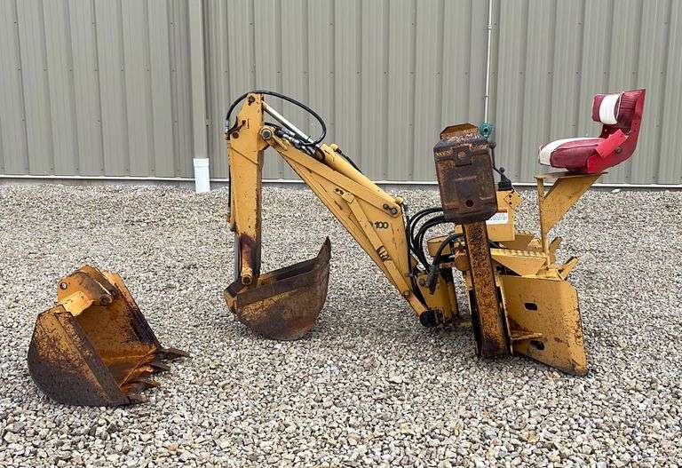 Case D100 skid steer backhoe attachment Schneider Auctioneers LLC