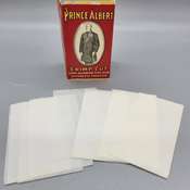 Cigarette roller and Prince Albert can & papers