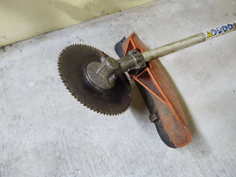 Stihl FS110R trimmer with saw blade head. Turns freely, but will not