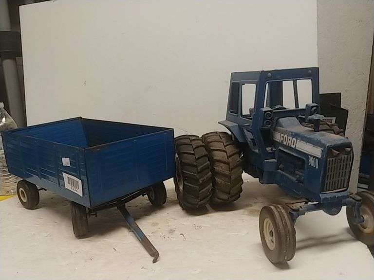 Blue metal ford 9600 tractor with rubber tires wagon trice auctions