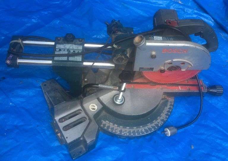 BOSCH 10” Slide Compound Miter Saw Model 3915. (End Brackets seen on it