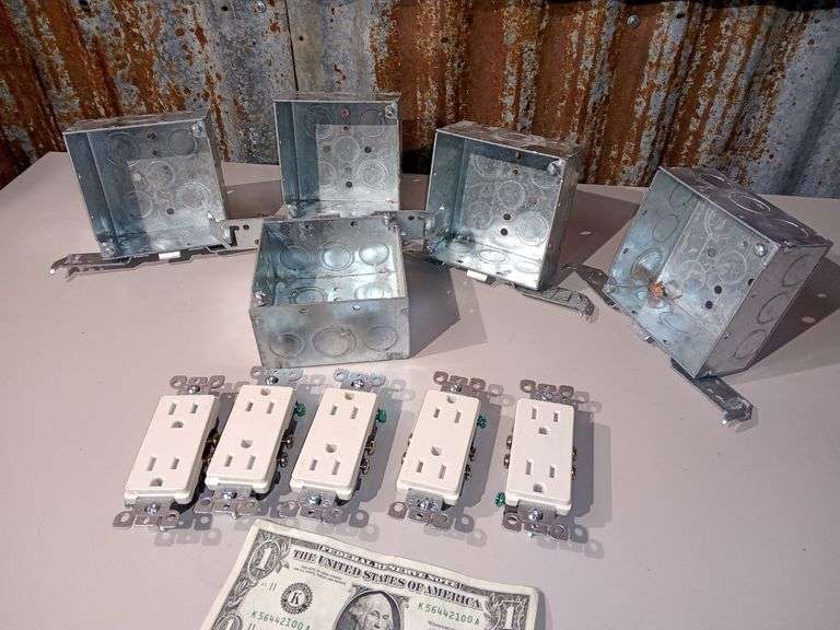 Five electrical gang boxes and five dual plug electric sockets all