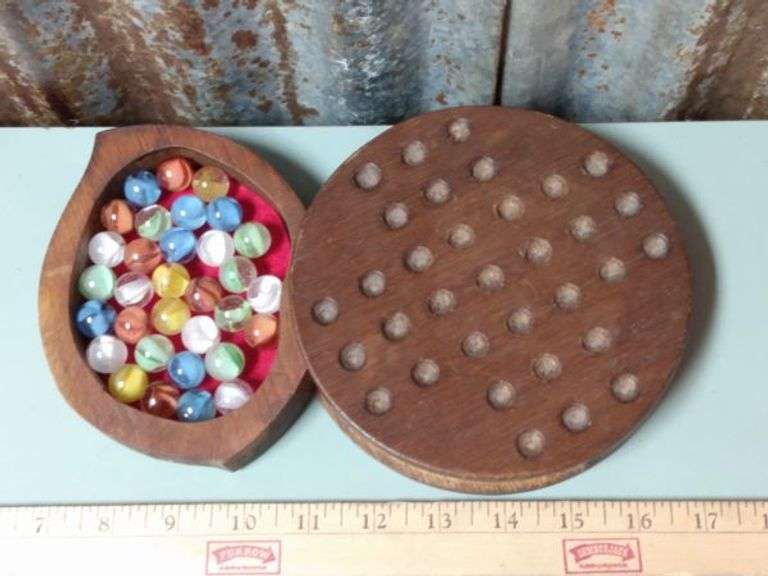 Vintage wooden marble solitaire game with built in storage for
