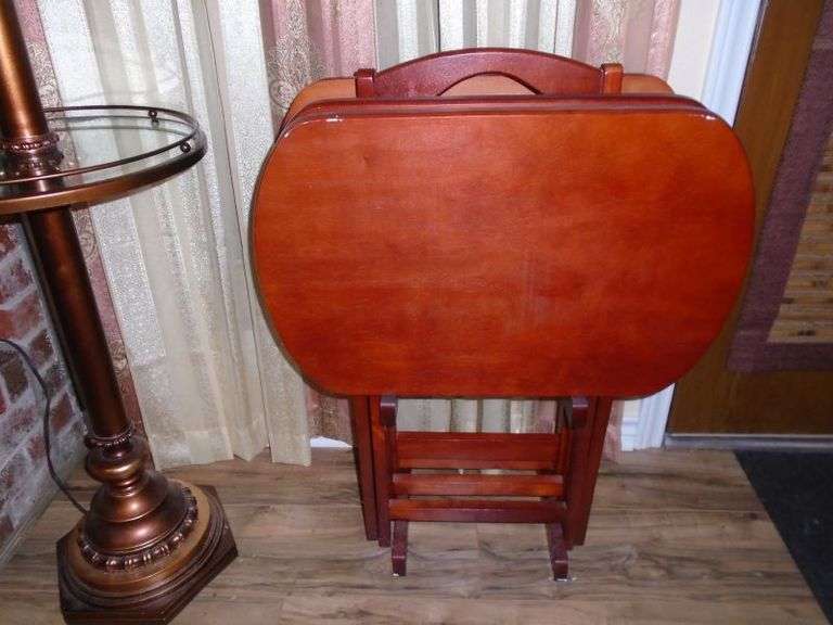 Set of 4 very nice wooden fold up tables w/ rack. Bring help to load