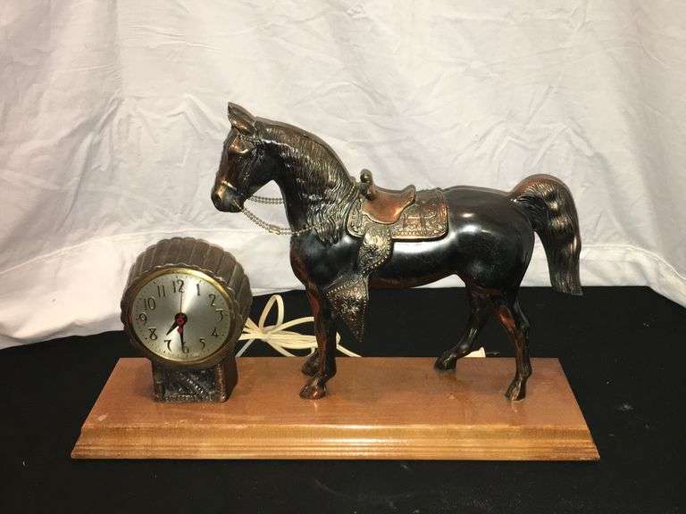 Metal horse clock with wood stand Wolfe Auction & Realty, LLC