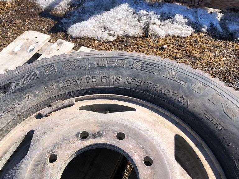 1 MICHELIN XPS TRACTION TIRE ON 8 BOLT RIM, TIRE SIZE P235/85R16