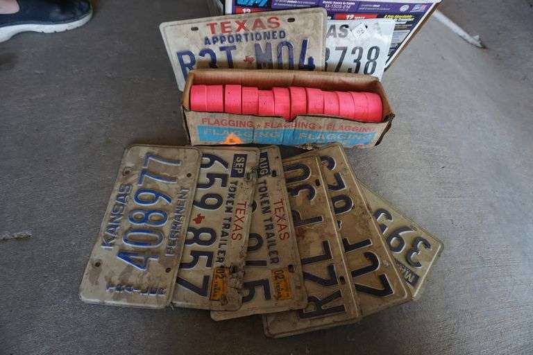 Assorted license plates and marking tape World Wide Auction Inc