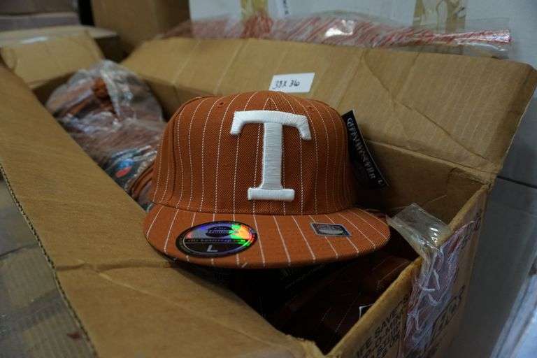 Box of Texas ball caps World Wide Auction Inc