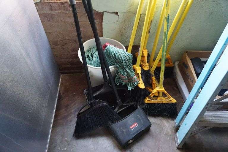 Lot of Brooms and mops World Wide Auction Inc