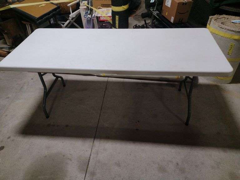 6 ft folding table. W. Yoder Auction